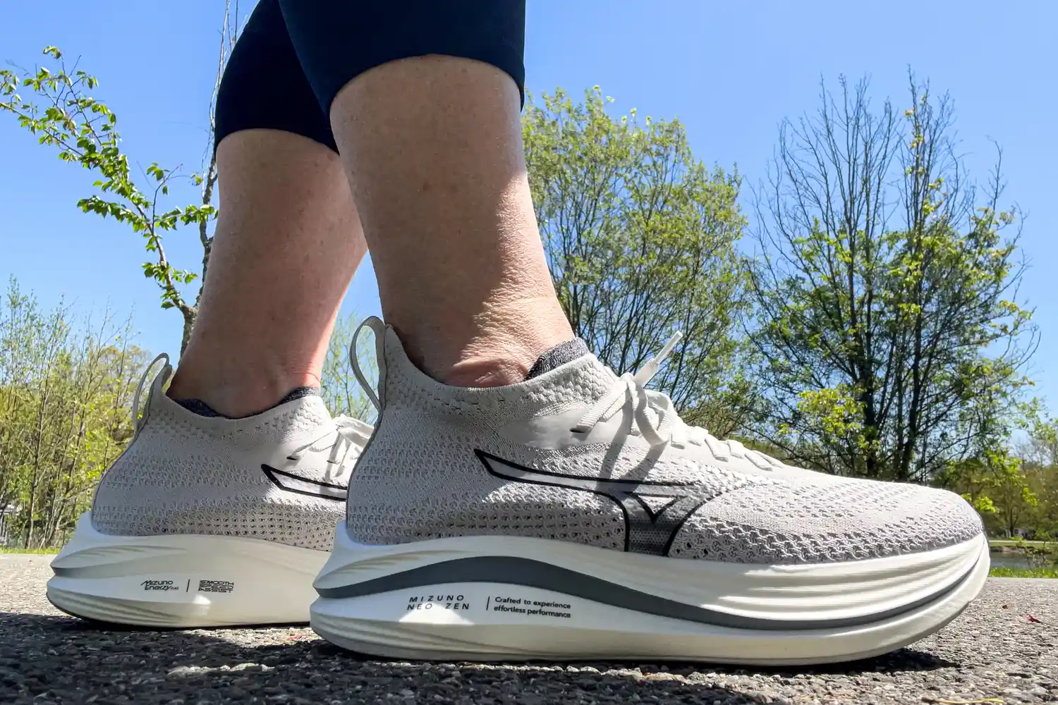 A side view of a person wearing the Mizuno Women's Neo Zen Running Shoes