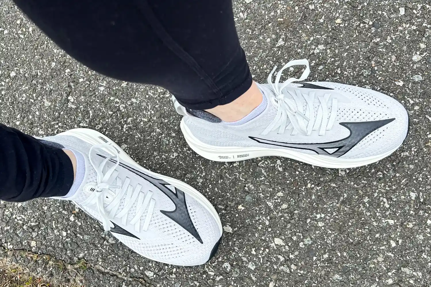 A person walks outside while wearing the Mizuno Women's Neo Zen Running Shoes