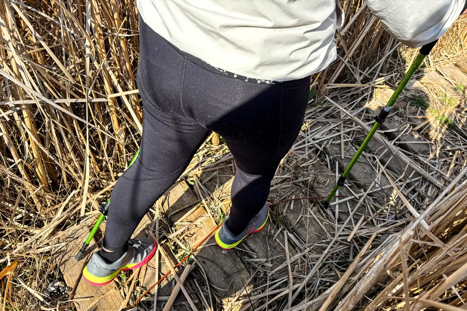 A person uses the Mountainsmith Tellurite 7075 OLS Trekking Poles while hiking