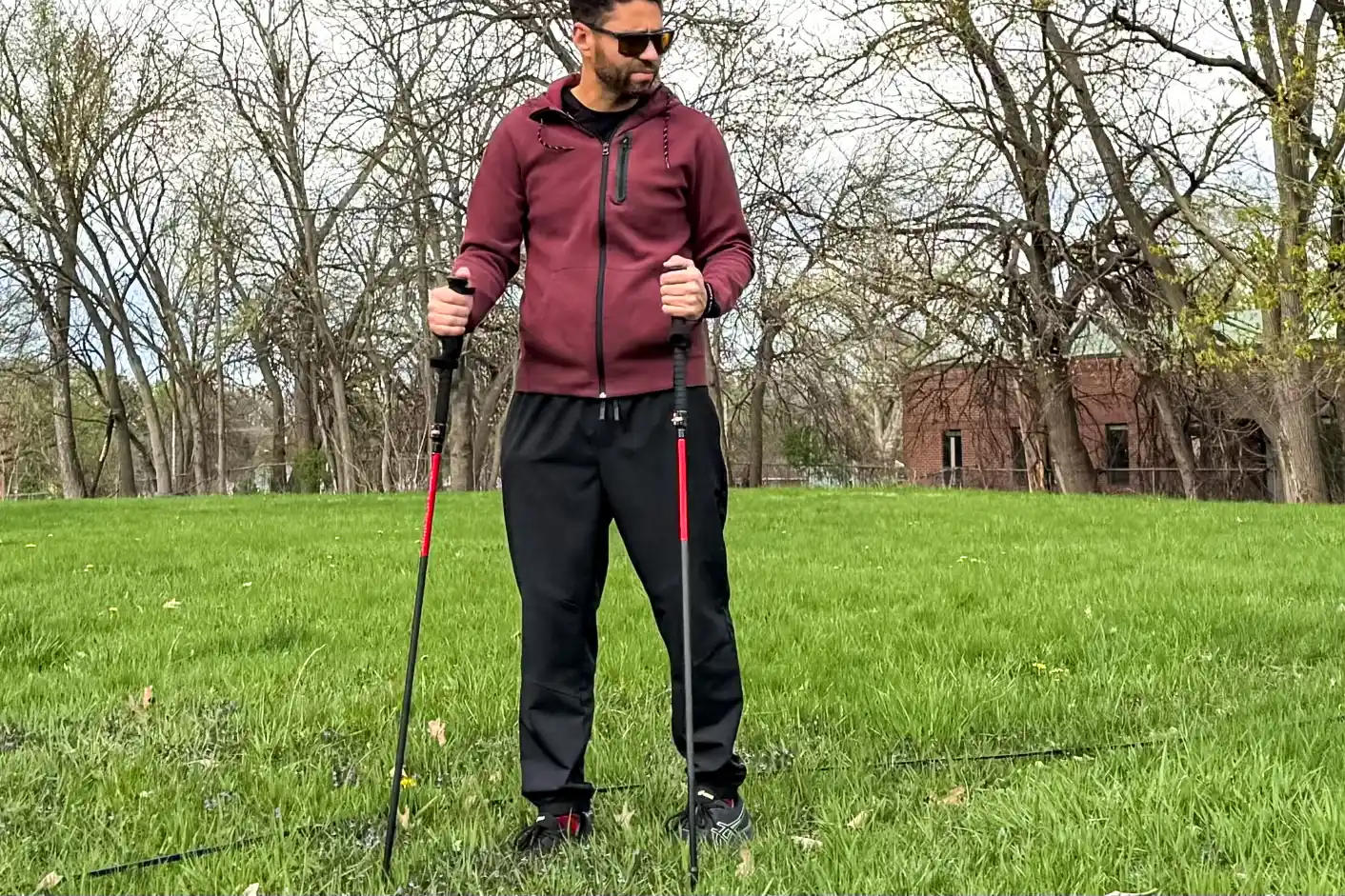 A person uses the Mountain Safety Research DynaLock Ascent Carbon Backcountry Poles while hiking
