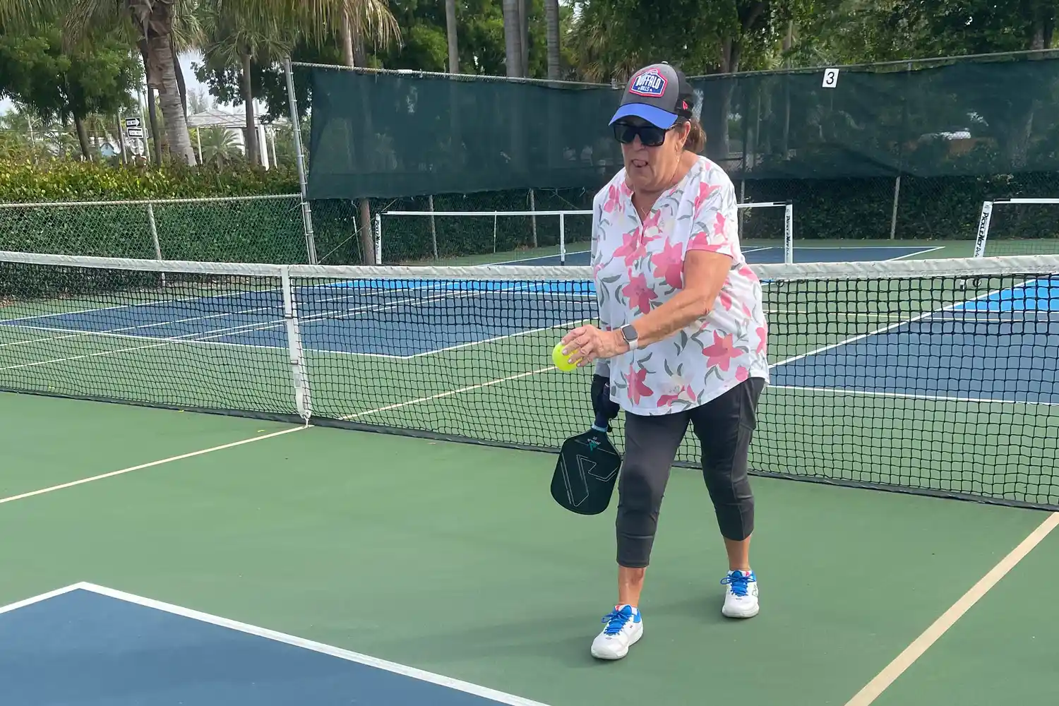 A person plays pickleball while wearing the New Balance Women's FuelCell 996v6 Pickleball Shoes