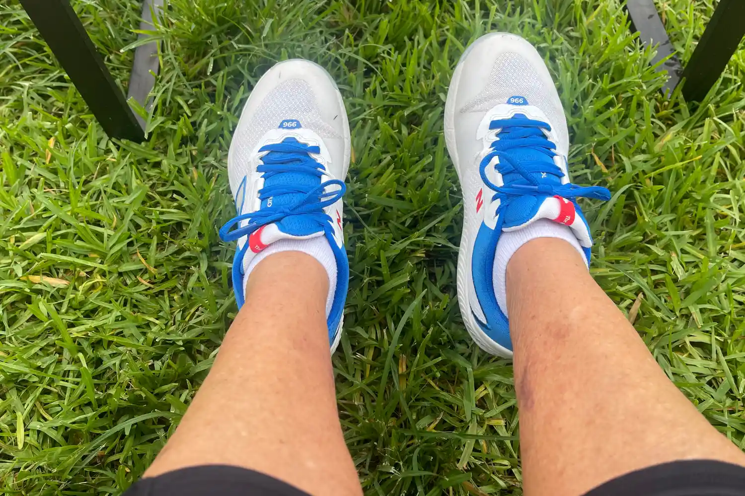 An overhead view of a person wearing the New Balance Women's FuelCell 996v6 Pickleball Shoes in grass