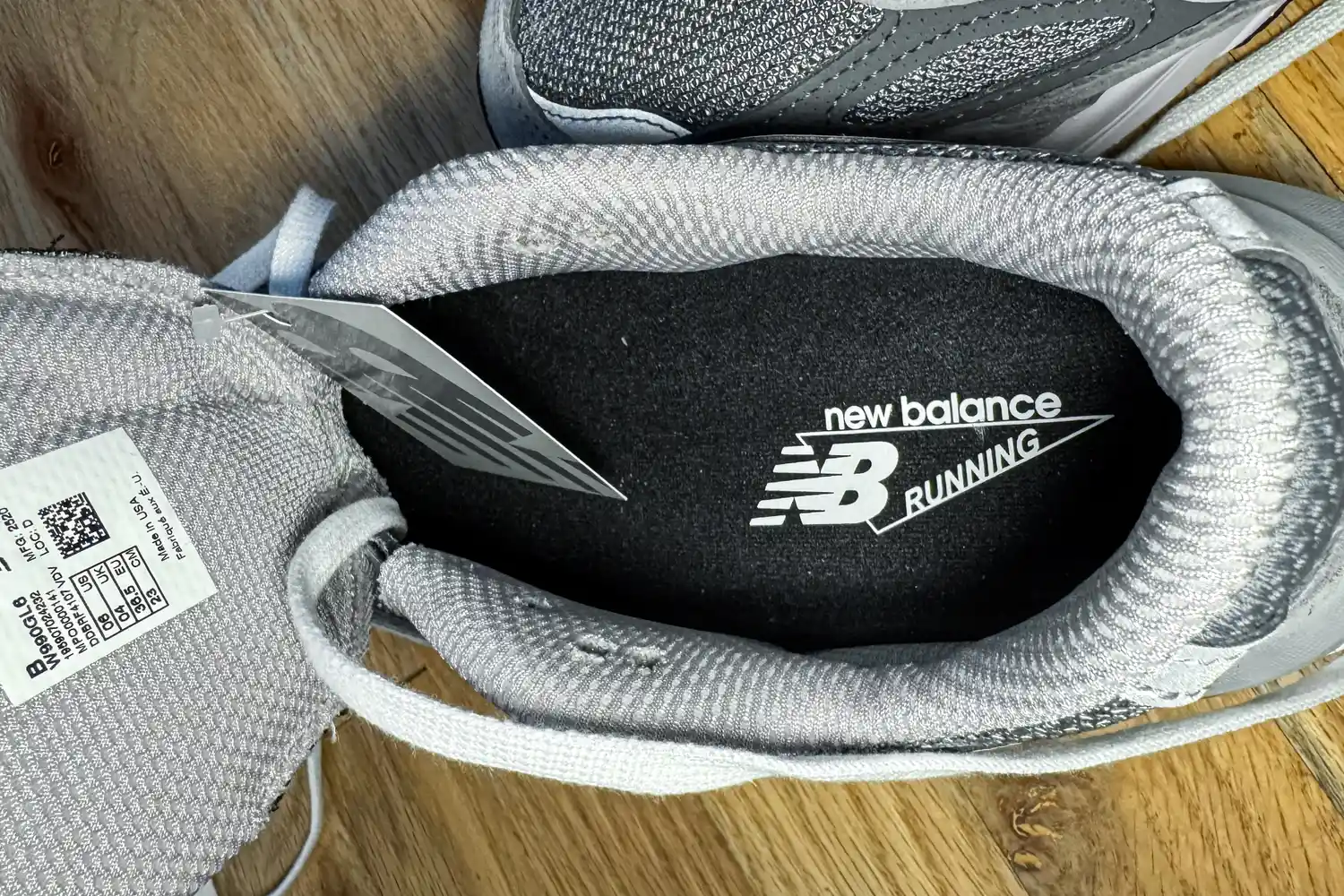 The brand name and logo printed on the sole of the New Balance Women's Made in USA 990v6 Sneakers