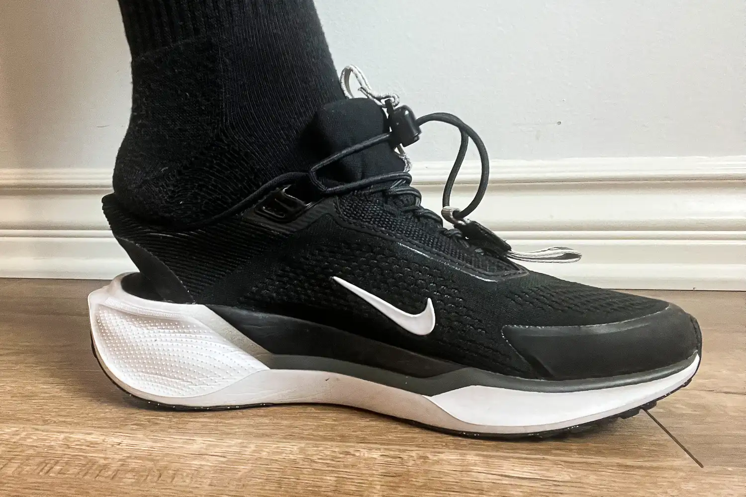 A side view of a person placing their foot into the Nike Pegasus EasyOn Women's Road Running Shoe