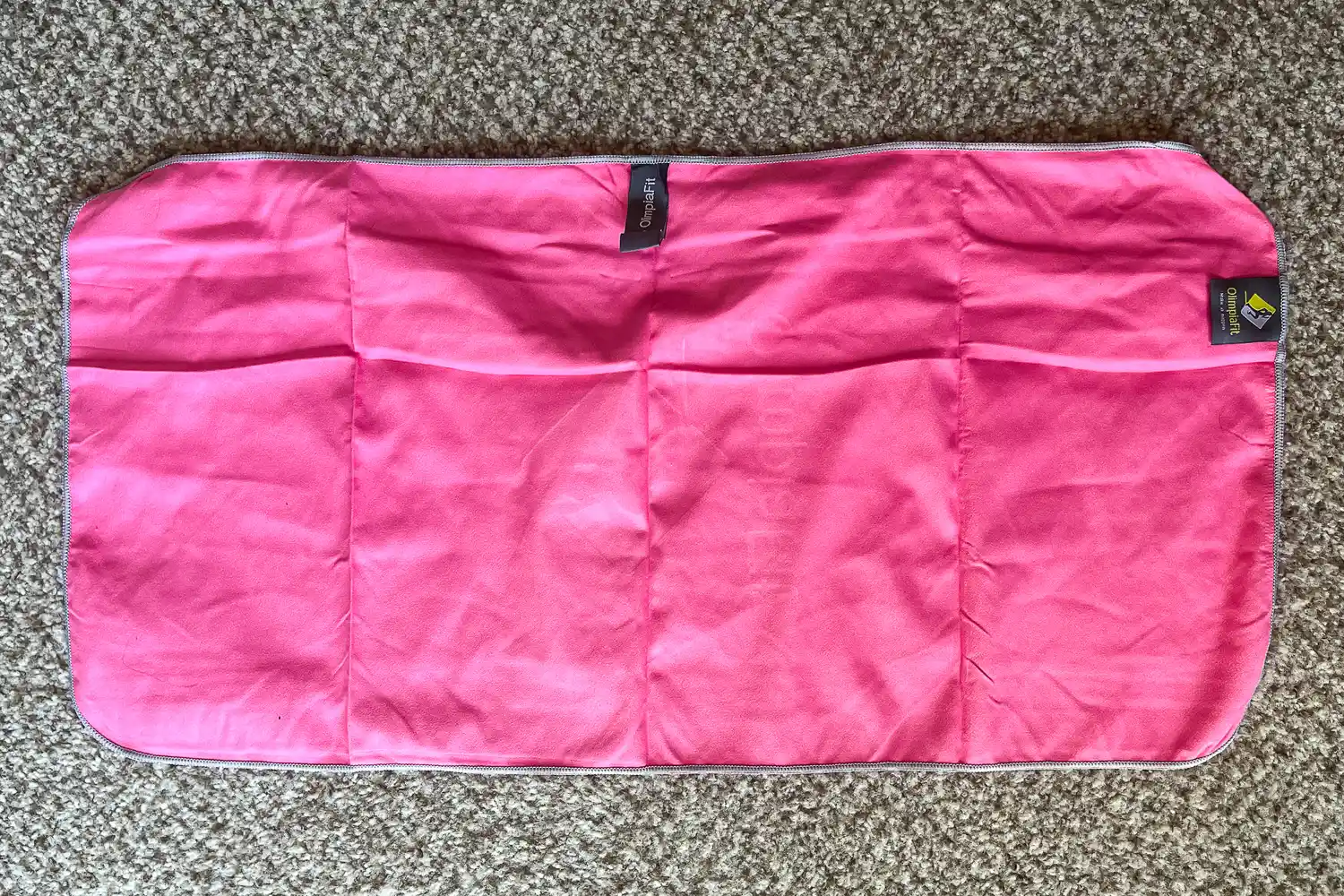 The OlimpiaFit Quick Dry Towel on carpet