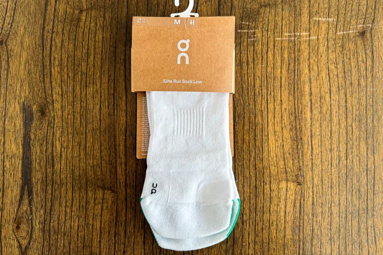 The On Running Elite Run Low Socks in packaging