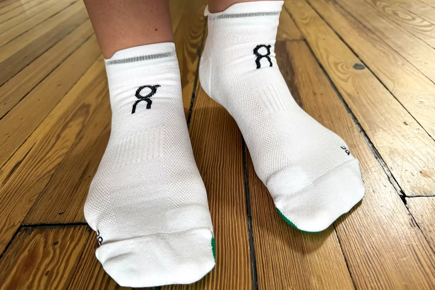 A person wears the On Running Elite Run Low Socks