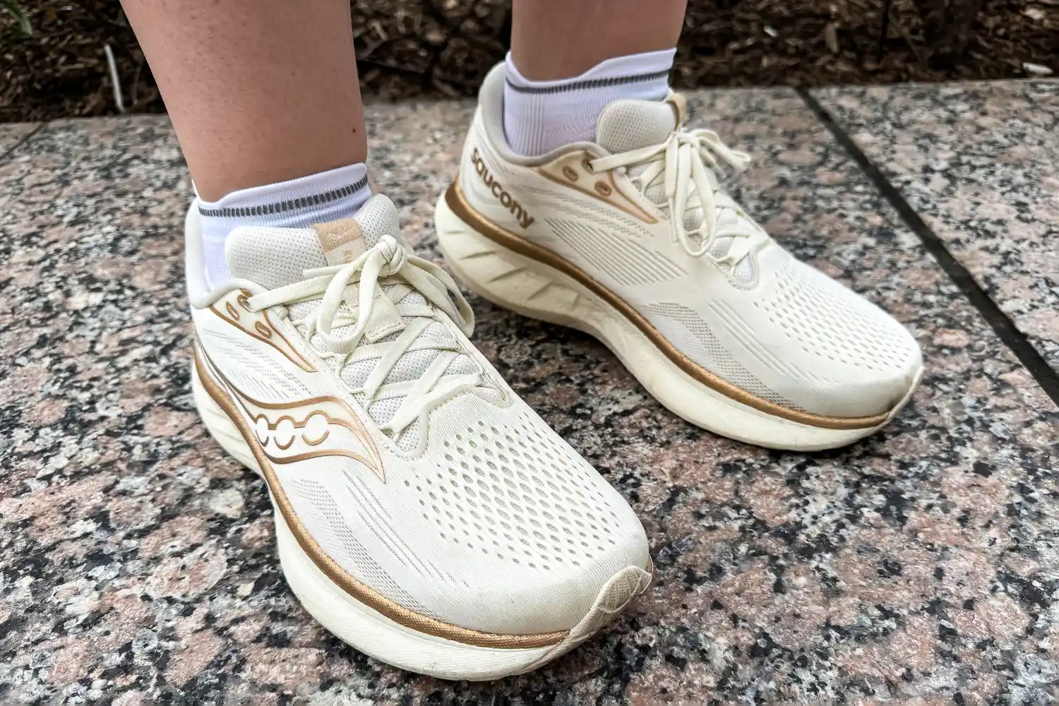 A person wears the On Running Elite Run Low Socks under running shoes