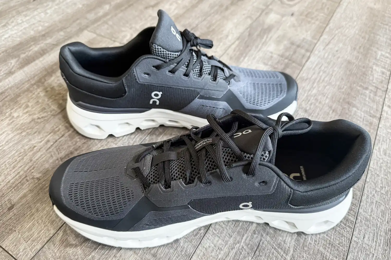 A side view of the On Running Men's Cloudrunner 2 Wide Running Shoes