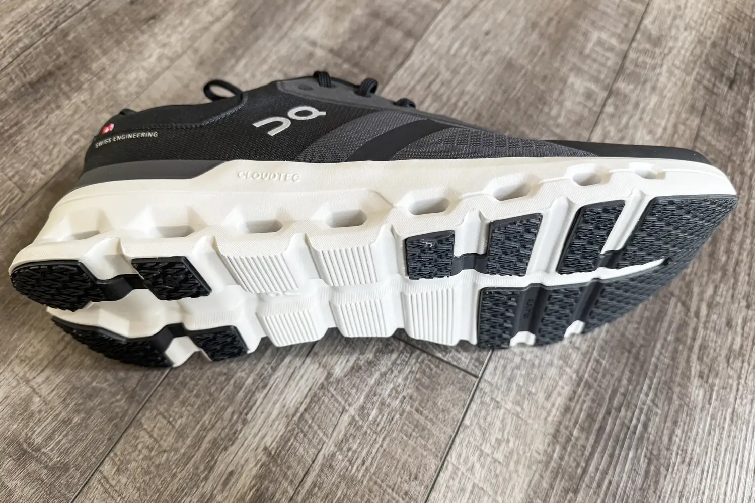 A side view of the On Running Men's Cloudrunner 2 Wide Running Shoe