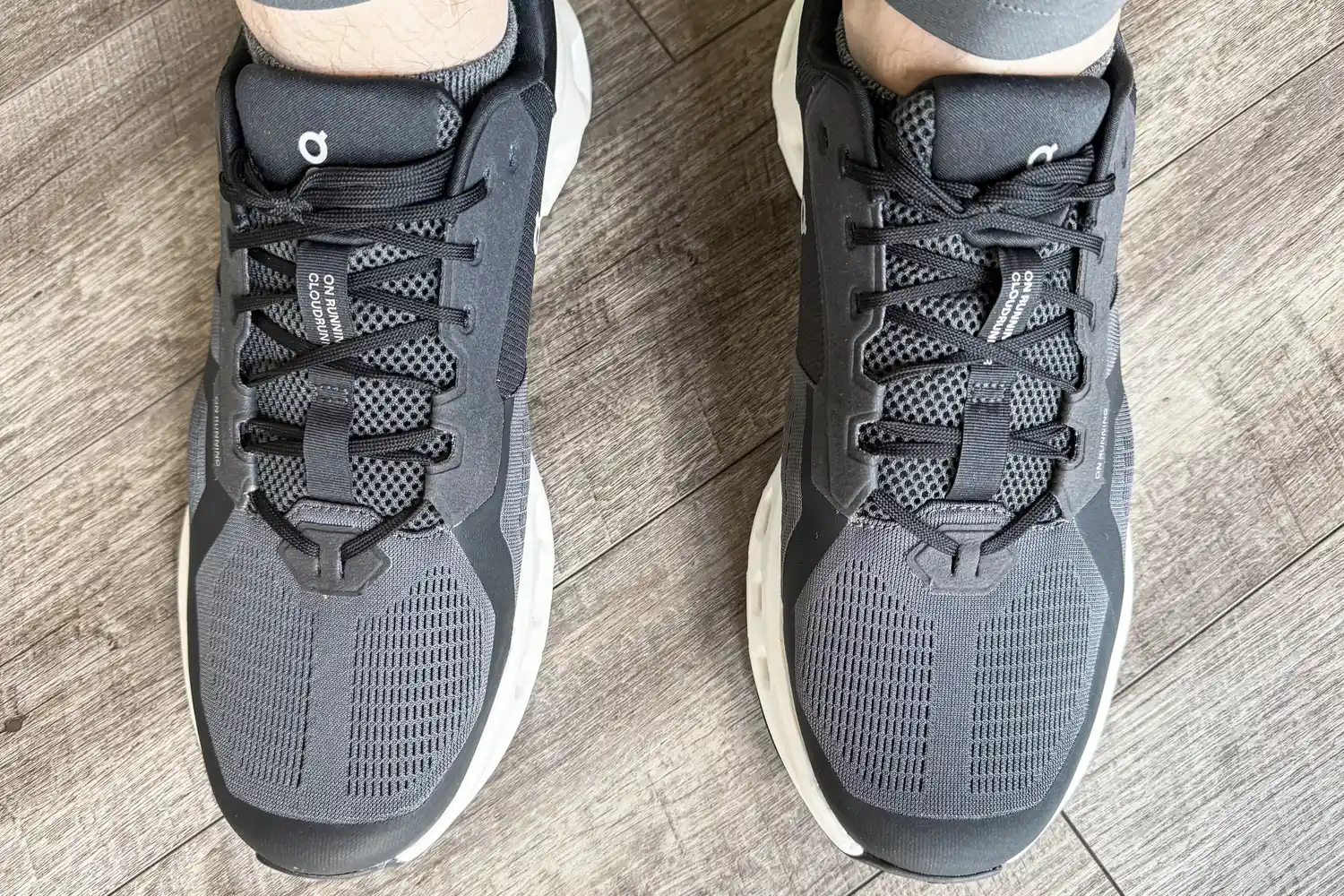 An overhead view of a person wearing the On Running Men's Cloudrunner 2 Wide Running Shoes