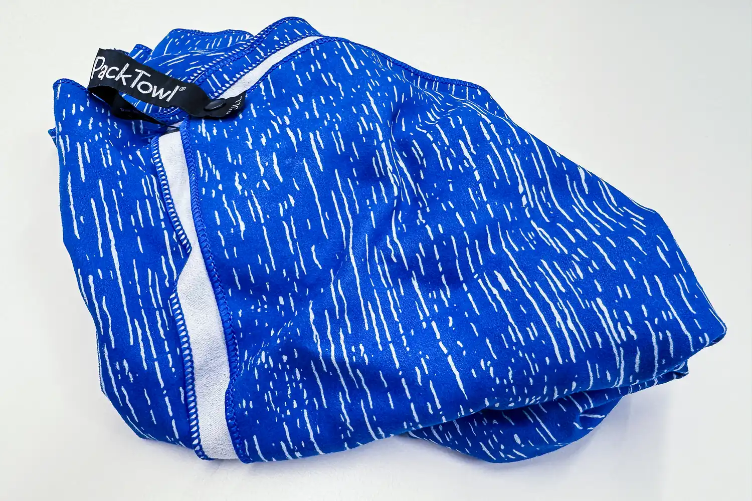 The PackTowl Personal Quick Dry Microfiber Towel folded up after use