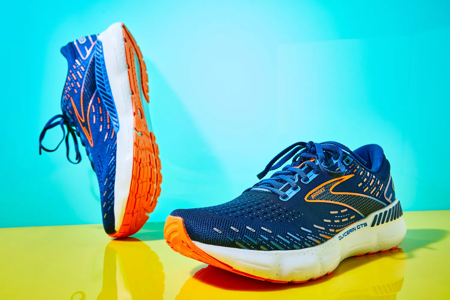 Brooks Men's Glycerin GTS 20 Running Shoes displayed on yellow and teal backdrop
