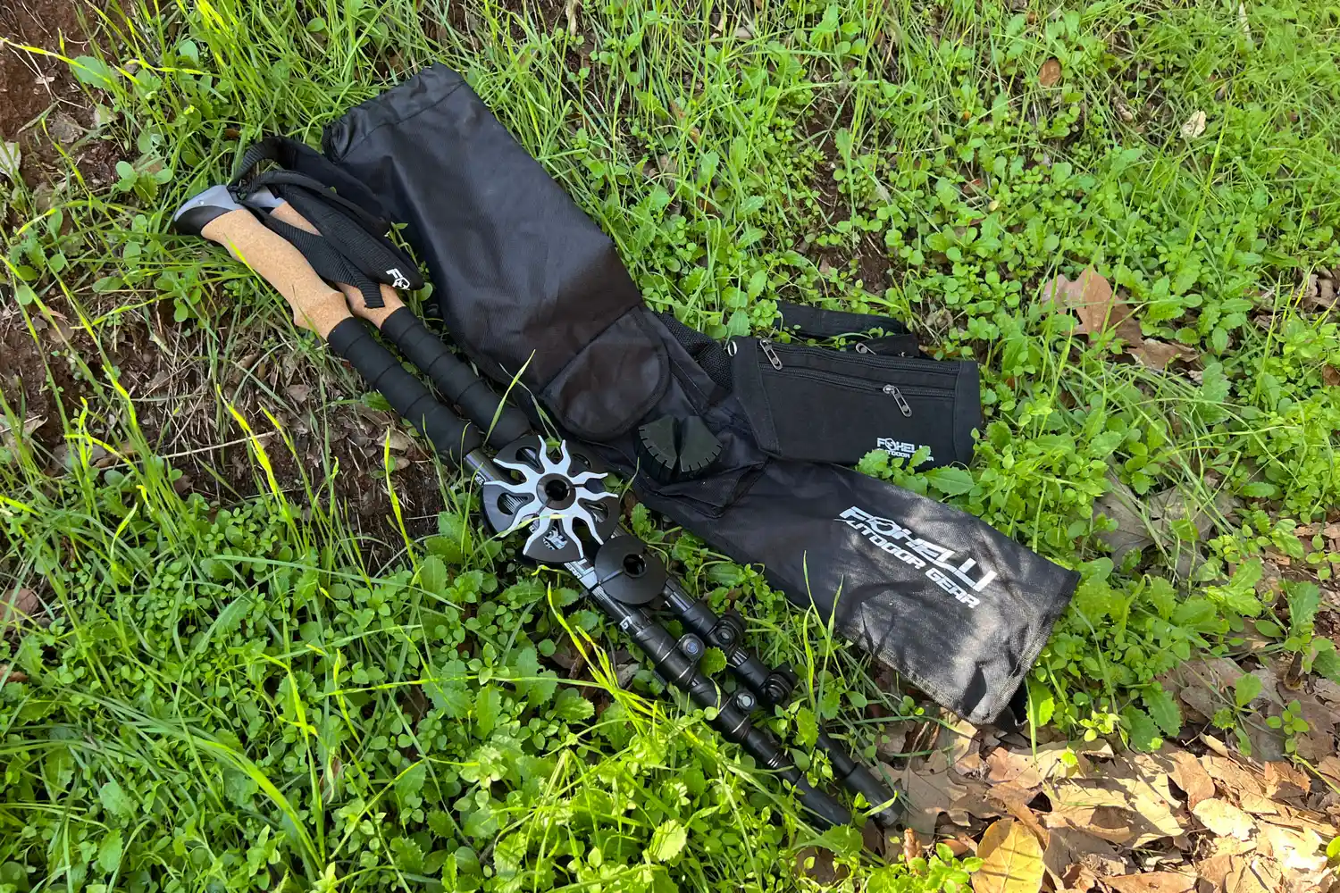 Foxelli Carbon Fiber Trekking Poles laying in grass
