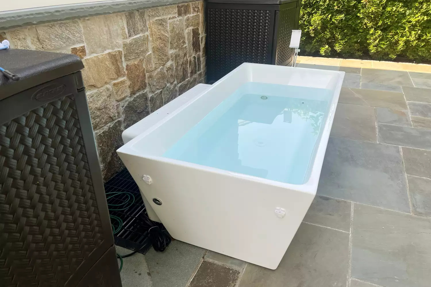 A PLUNGE cold tub on a patio