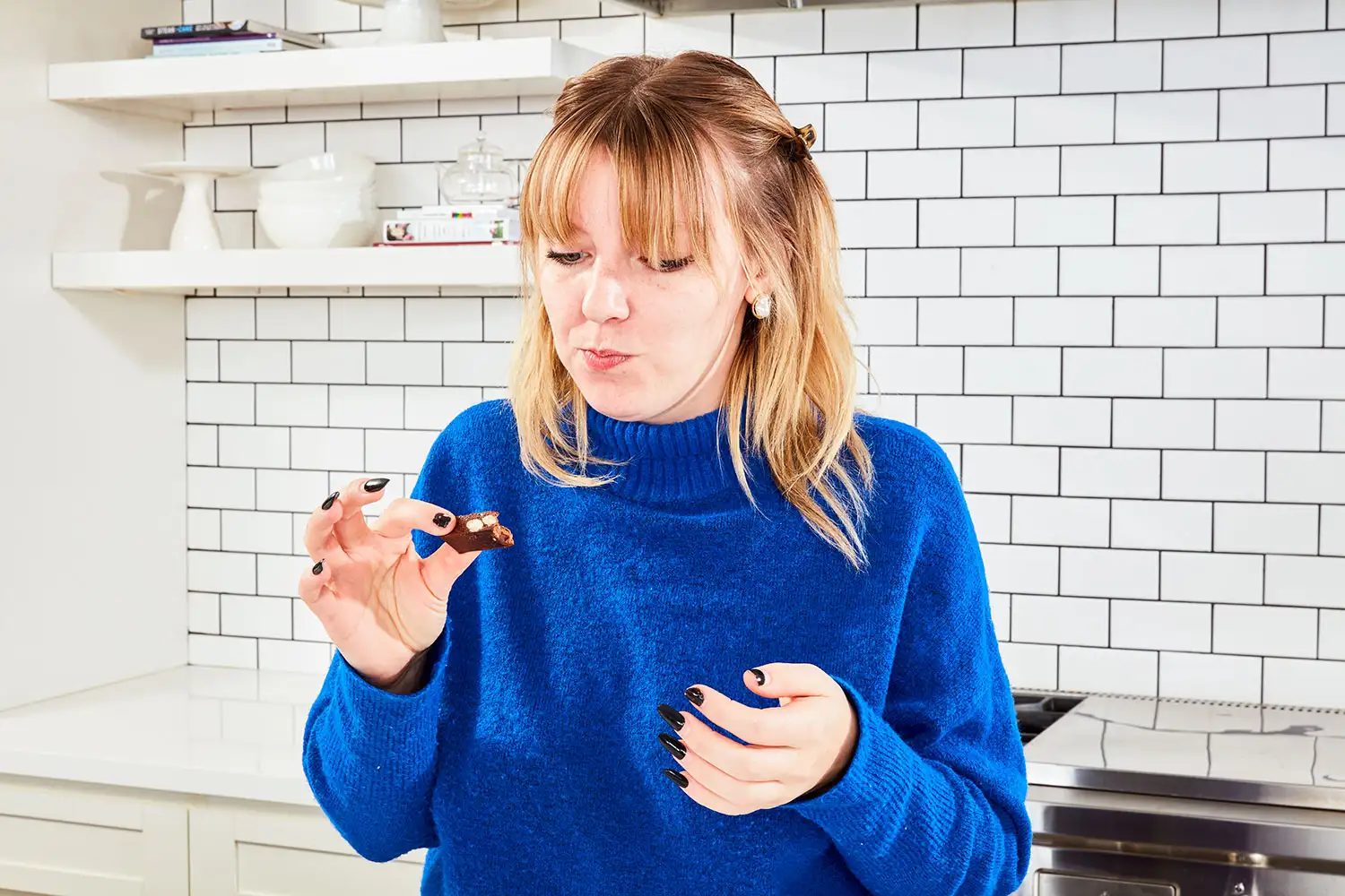 Person eating RXBAR Protein Bars