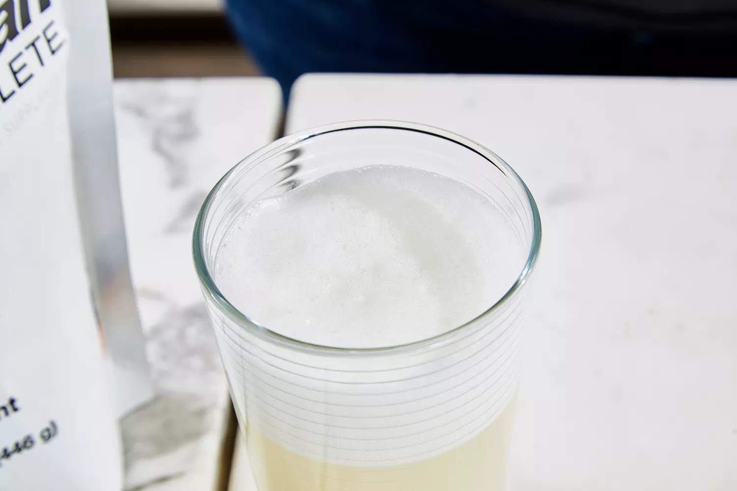 A glass of Klean Athlete Klean Isolate Protein Powder