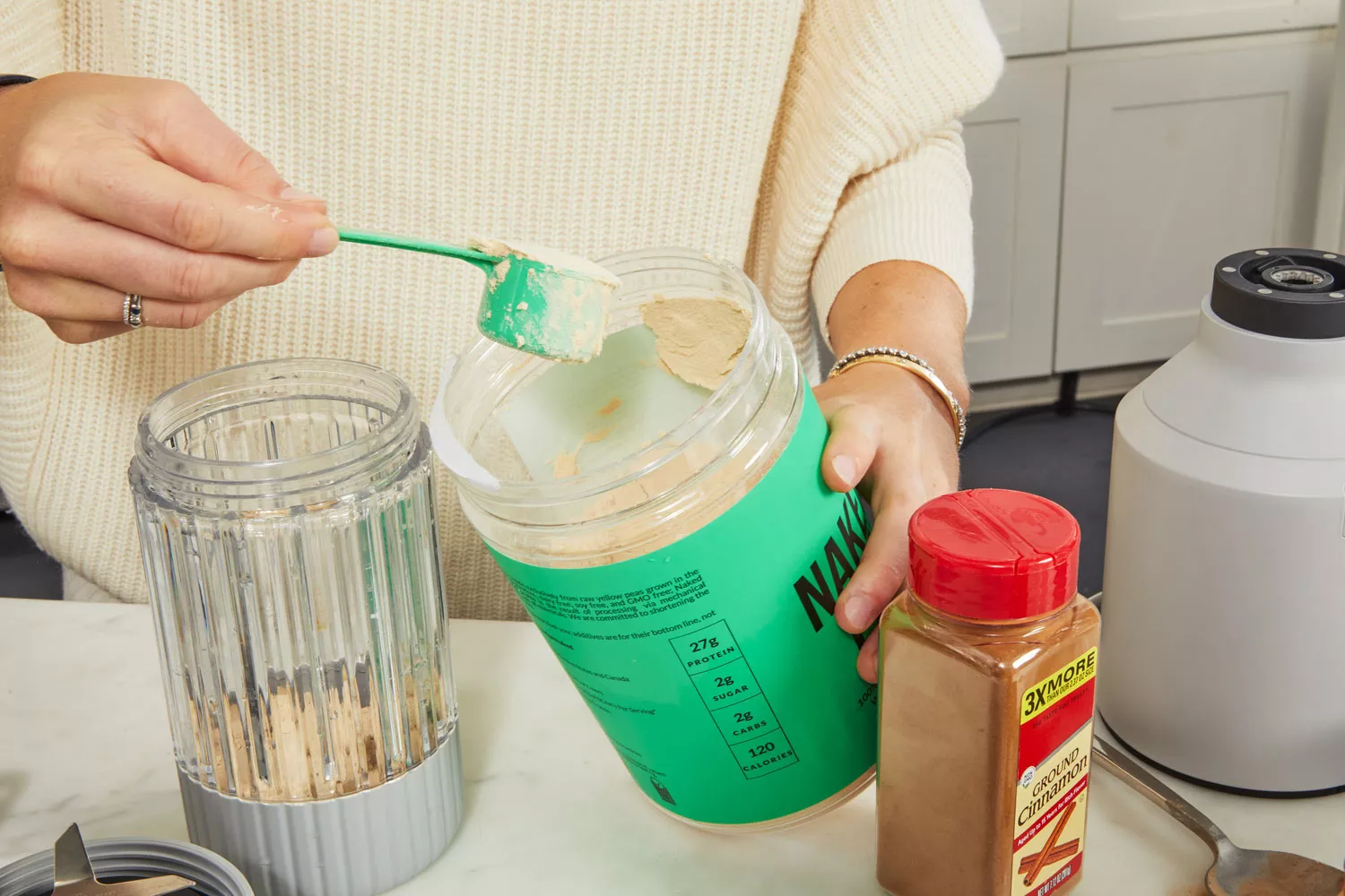 Person scooping NAKED nutrition NAKED PEA 1LB Pea Protein Isolate from jar