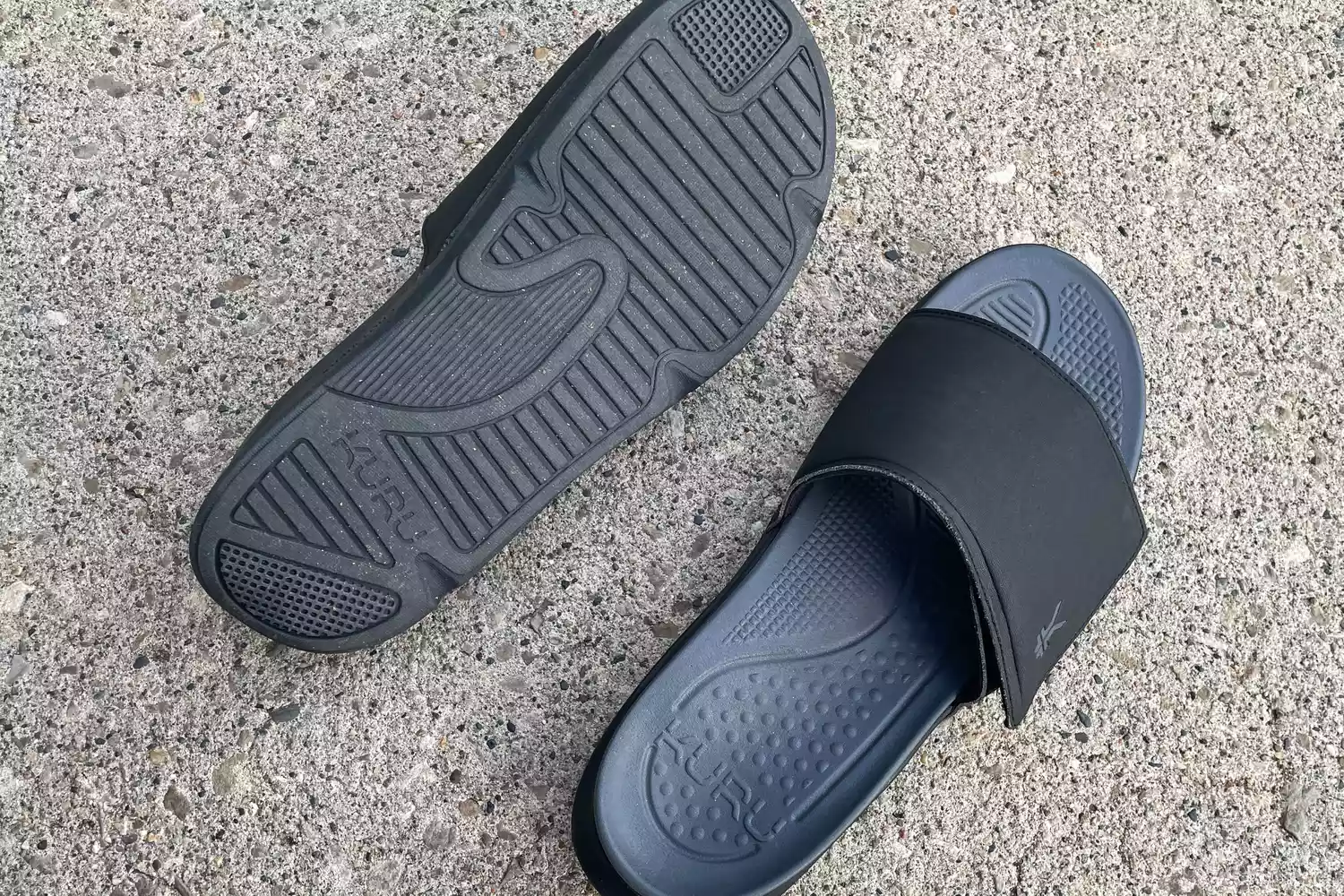A pair of Kuru Men's Moment Slide Sandals