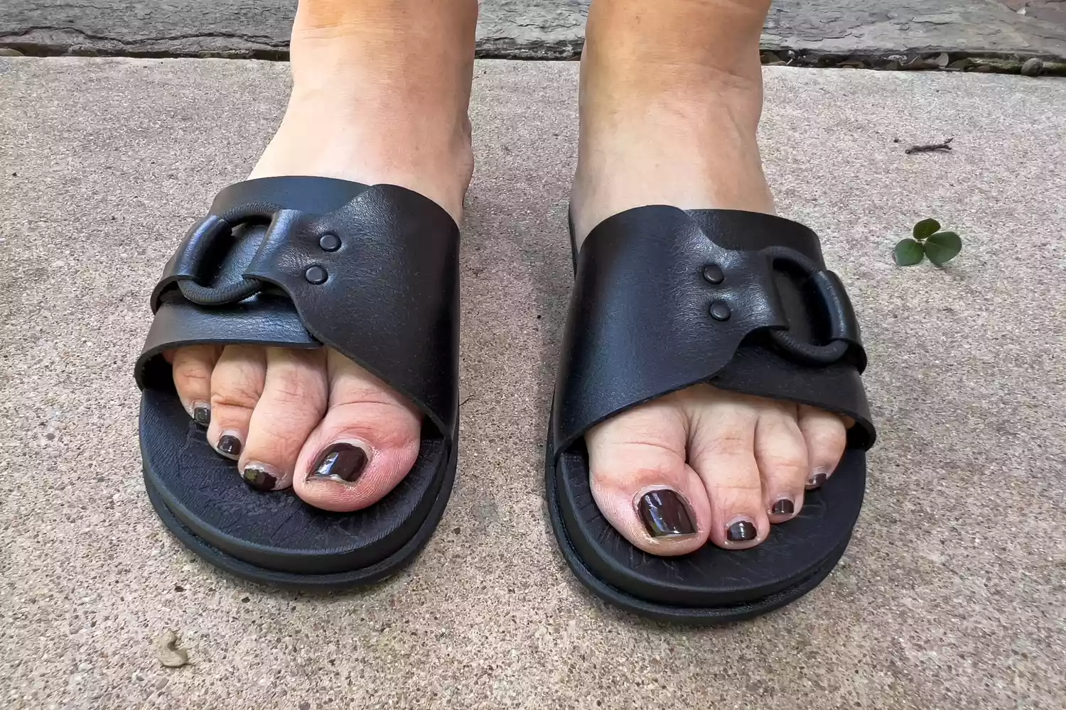 A front view of a person wearing the Reef Women's Cushion Soho Cruz Sandals