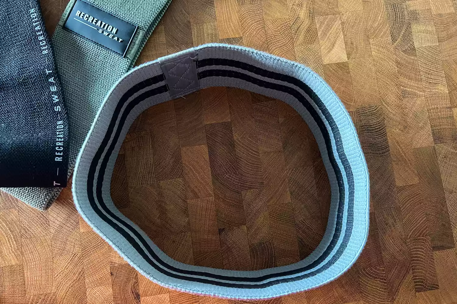 The Recreation Sweat Resistance Bands 2.0 on a wooden surface with one standing on its side