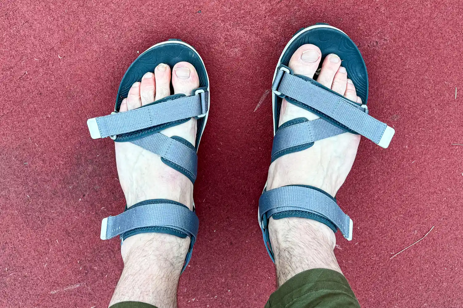 An overhead view of a person wearing the Reef Men's Cross-Shore Sandals