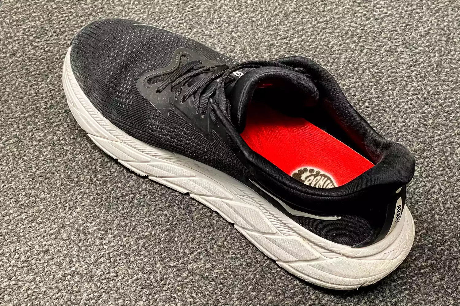 The Remind Insoles REMEDY IMPACT 5.5MM Custom Arch Heat Moldable Insoles inside a sneaker