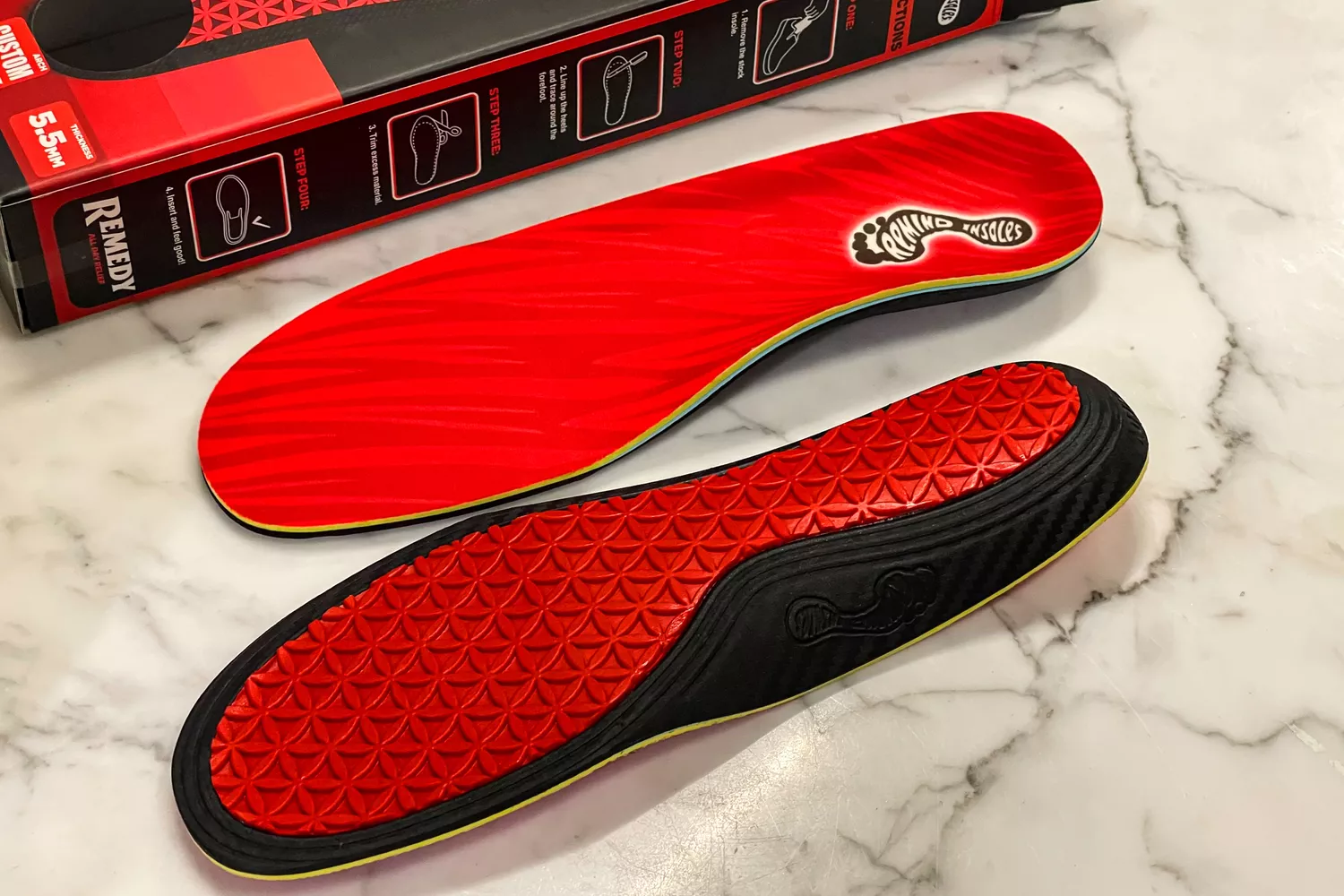 The top and underside of the Remind Insoles REMEDY IMPACT 5.5MM Custom Arch Heat Moldable Insoles