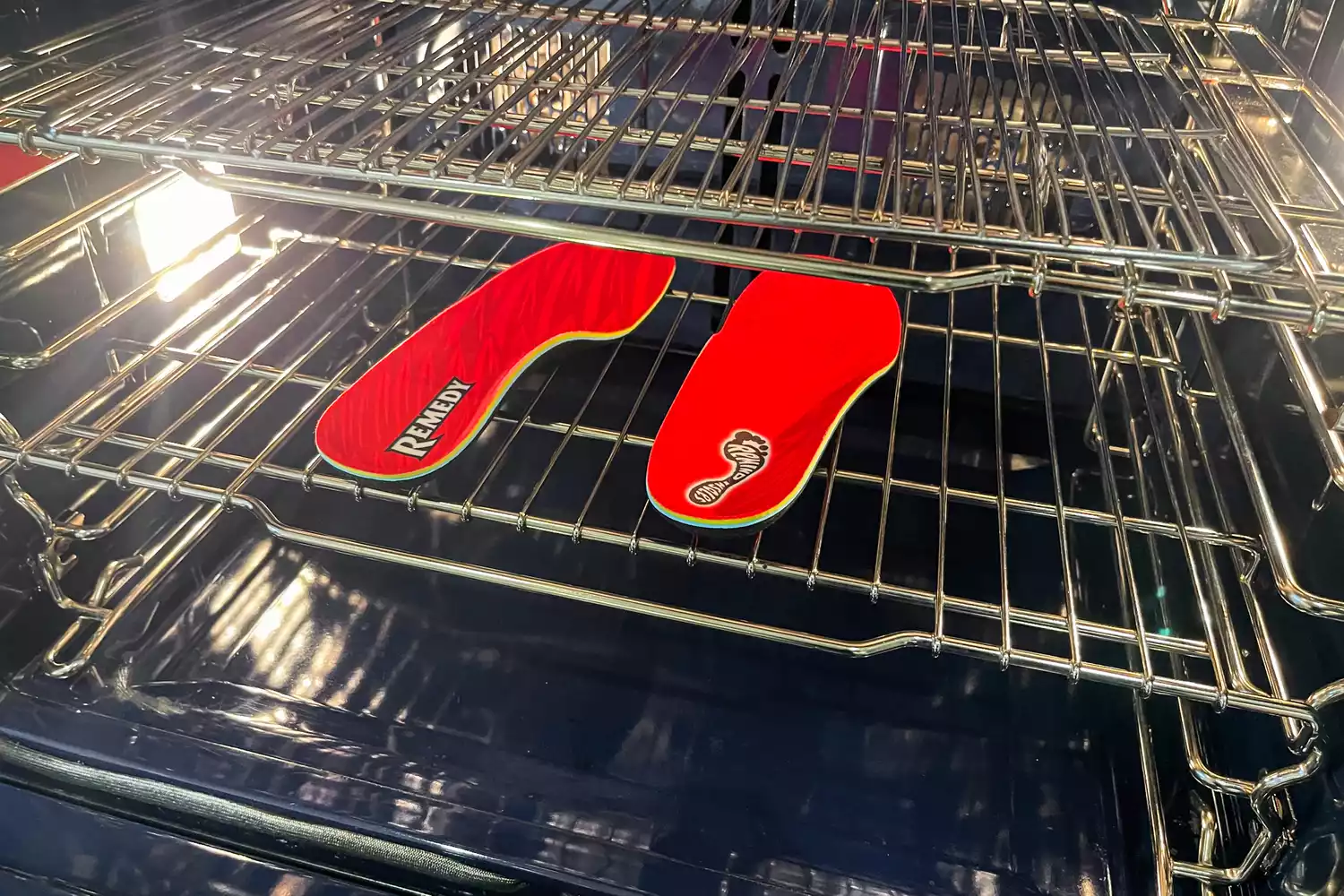 The Remind Insoles REMEDY IMPACT 5.5MM Custom Arch Heat Moldable Insoles are molded inside an oven