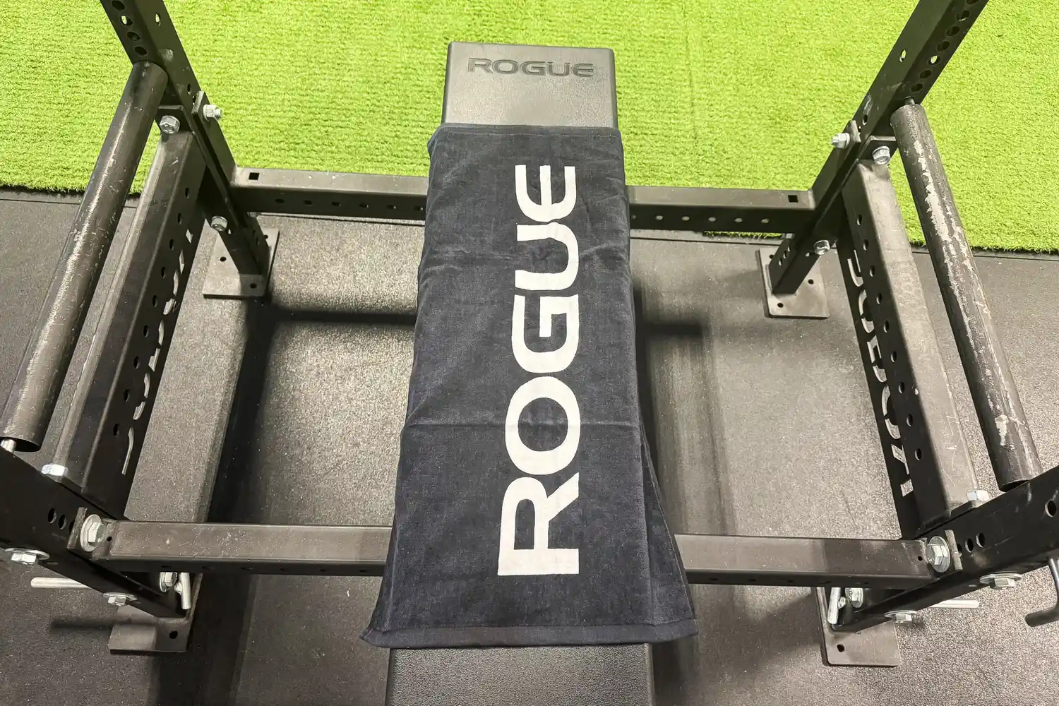 The Rogue Gym Towel on a weight bench