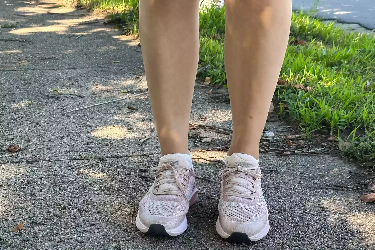 A person standing outside while wearing MBT Huracan 3000 Running Shoes