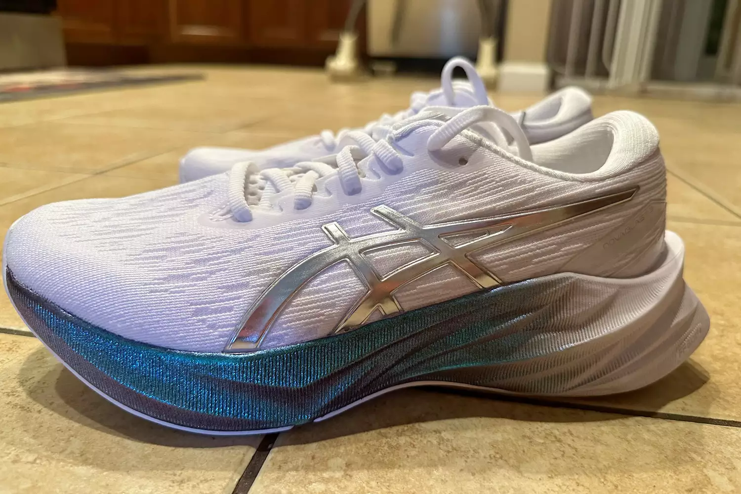 Asics Novablast 3 Platinum sitting on floor
