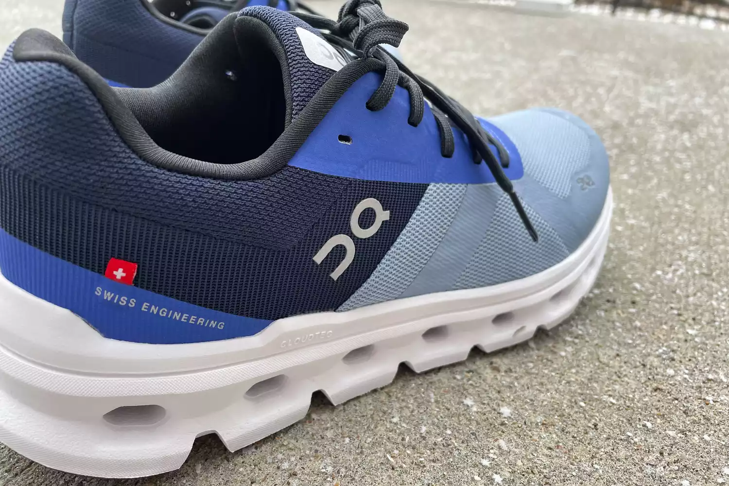 On Women's Cloudrunner displayed on concrete 