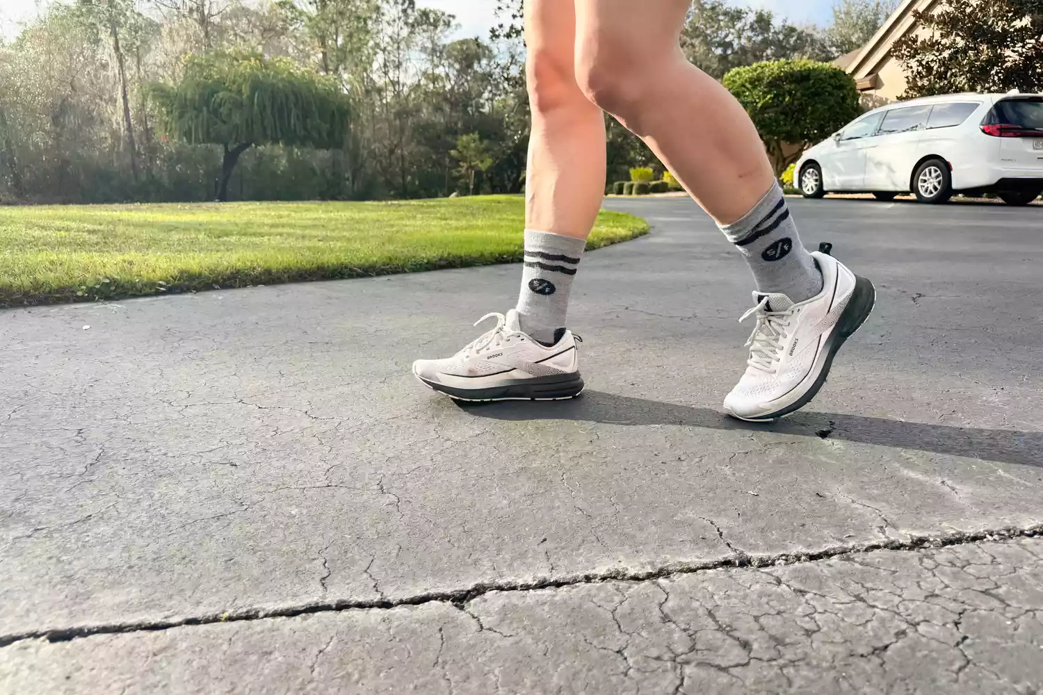 A person walks outside while wearing the Brooks Trace 3 Women's Running Shoes