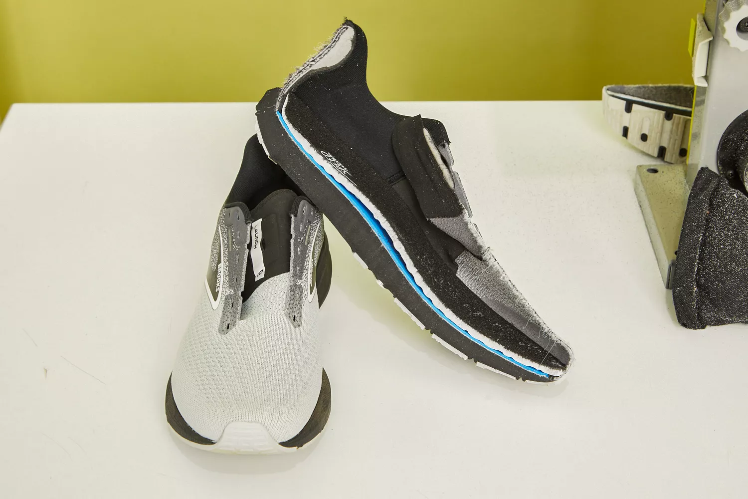 Brooks Launch 10 cut in half and sitting on a white counter