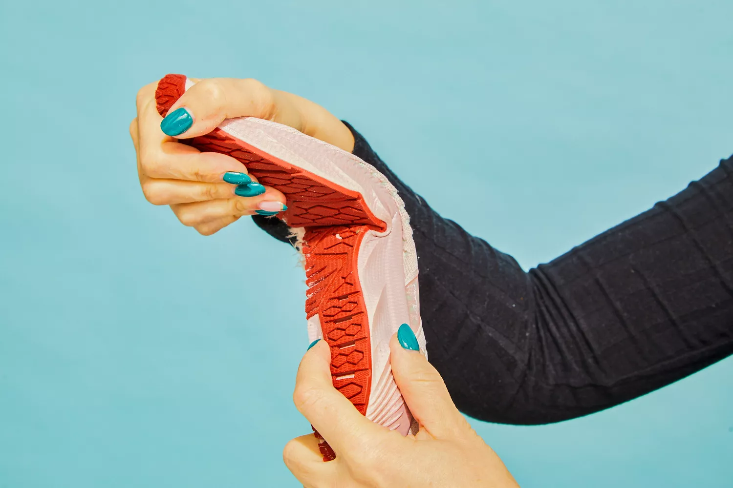 A person bending the Brooks Levitate 6