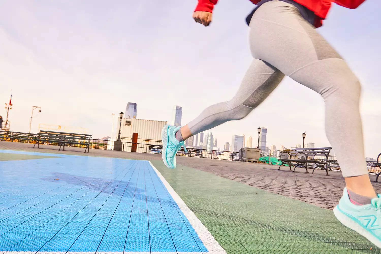 Person running outdoors wearing New Balance Women's Fresh Foam X 1080 v13