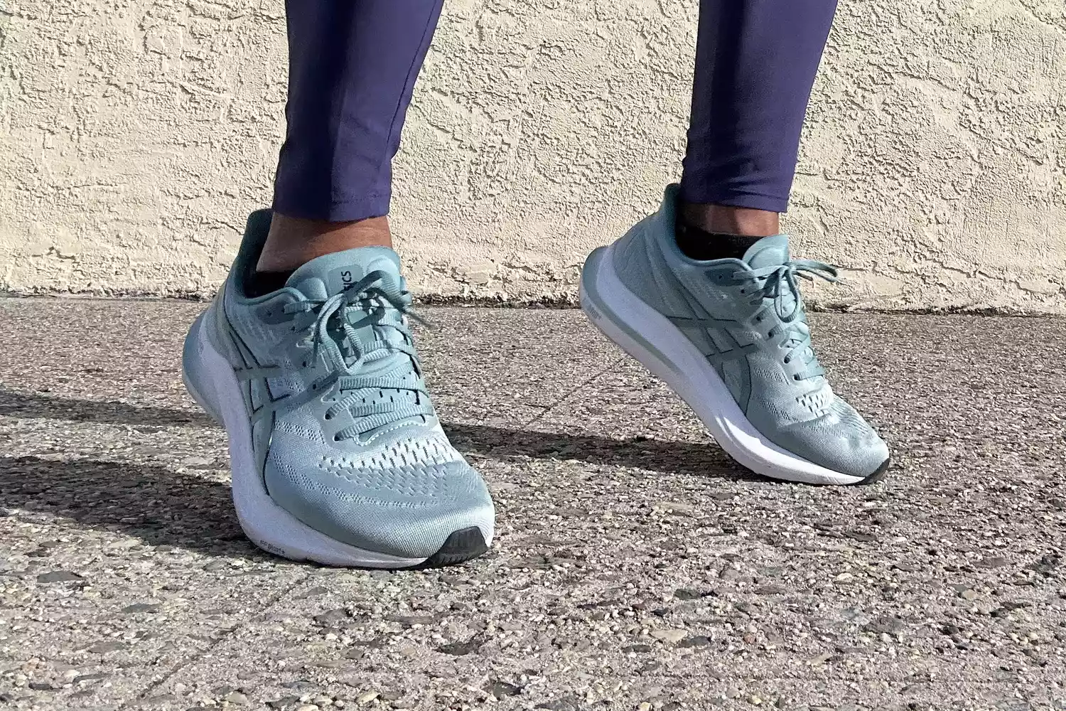 A person posing in the Asics Women's GT-2000 12 sneakers