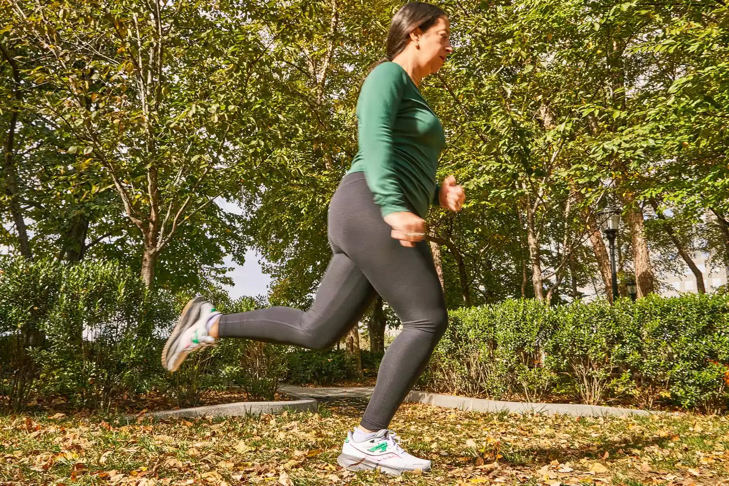 A person running outdoors in Saucony Women's Guide 16 Sneakers