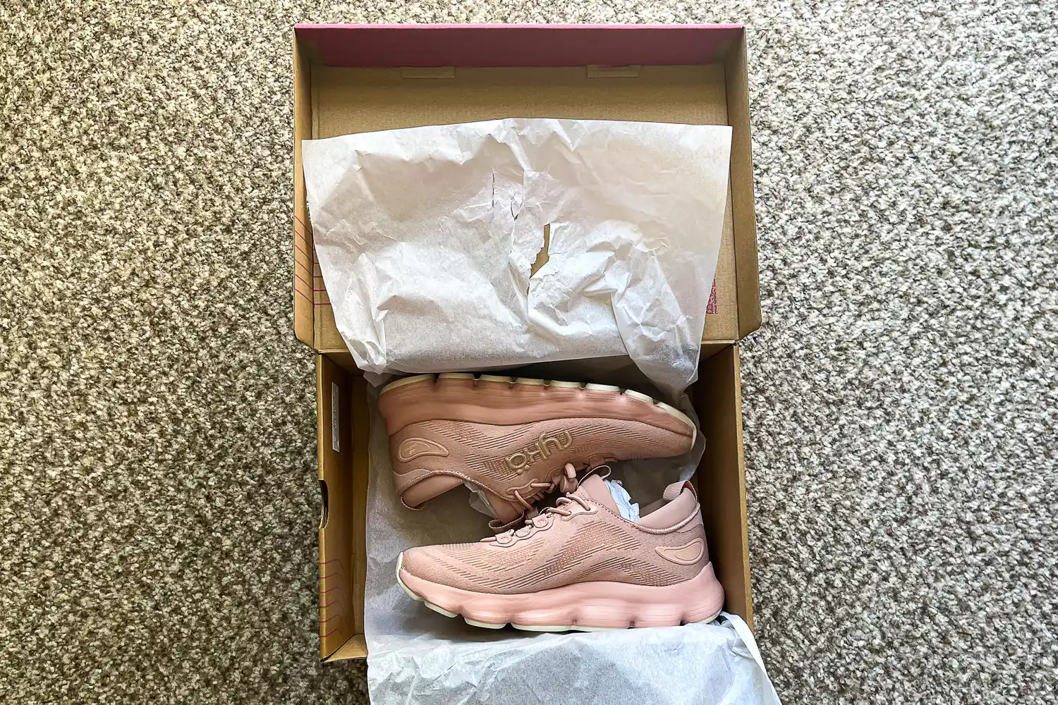 A pair of Rykä Women's Podflow EZ Walking Sneakers in a shoebox