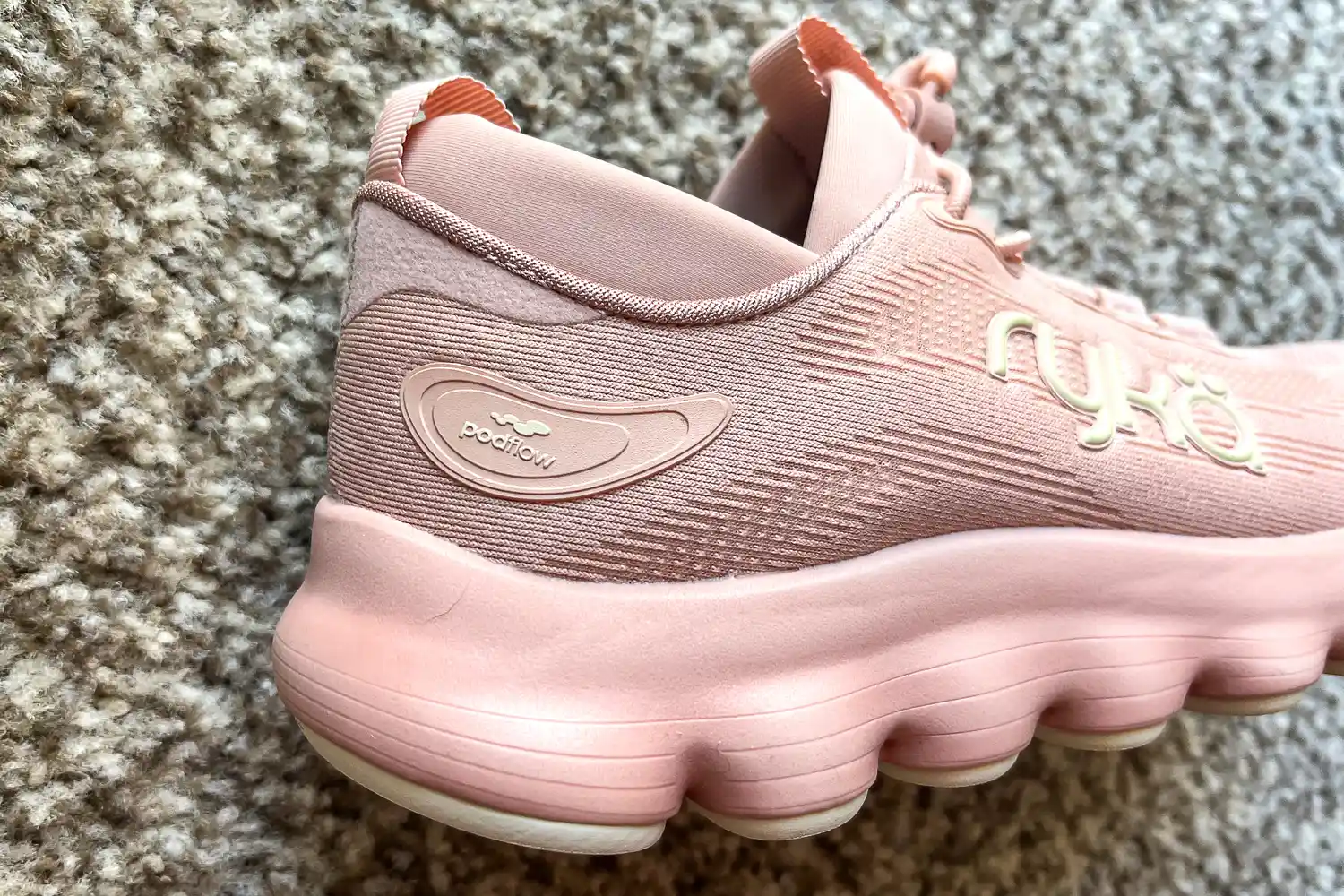 The brand name on the side of the Rykä Women's Podflow EZ Walking Sneaker