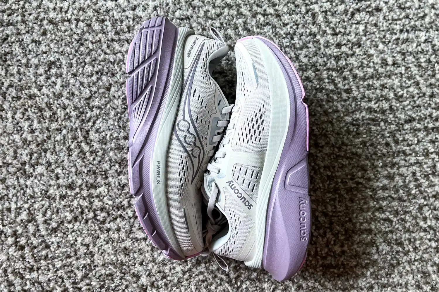 A pair of Saucony Women's Guide 18 Sneakers side-by-side on the floor