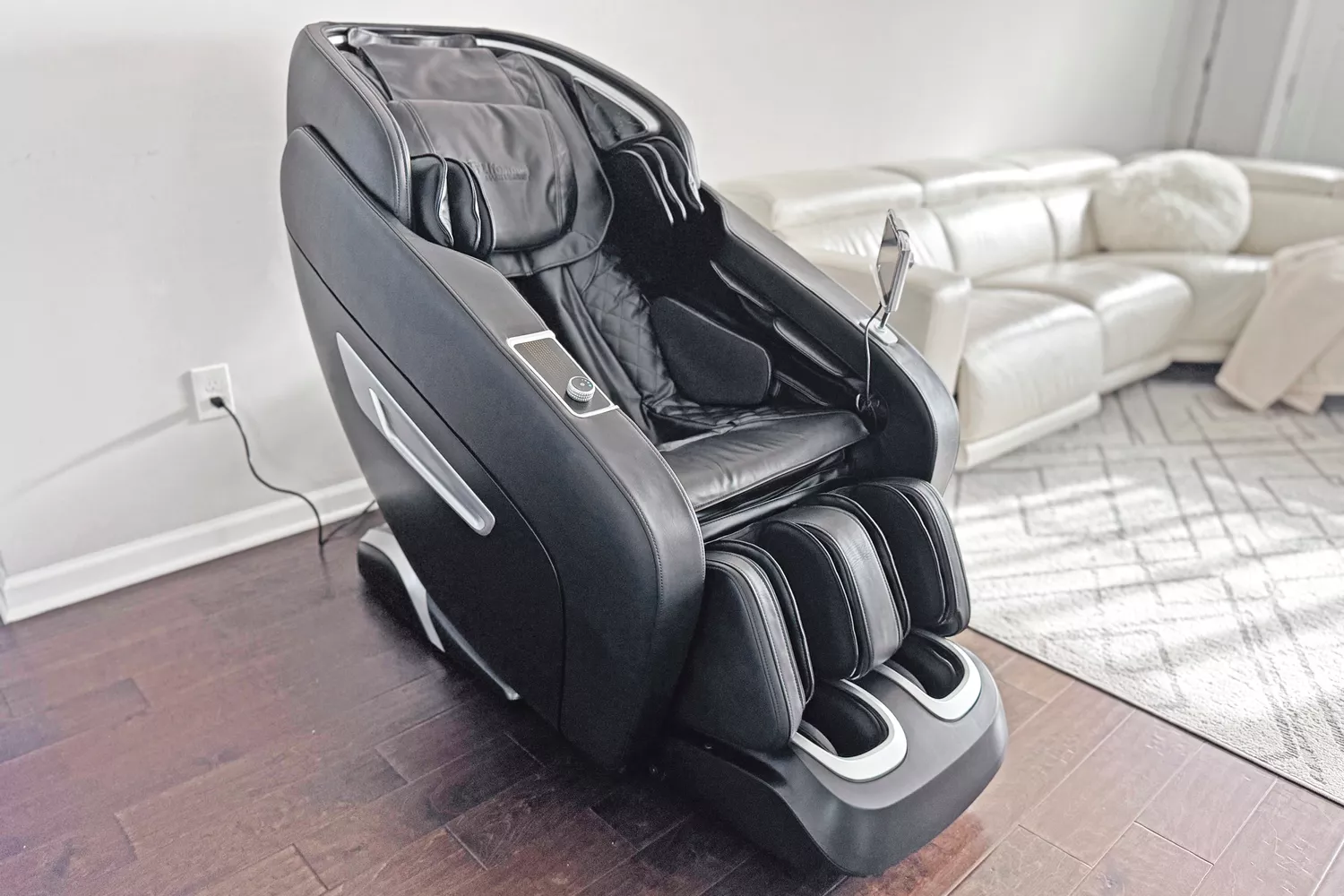 The SCS Make Life Easy Lifesmart R775W 4D Massage Chair plugged in a living room setting 