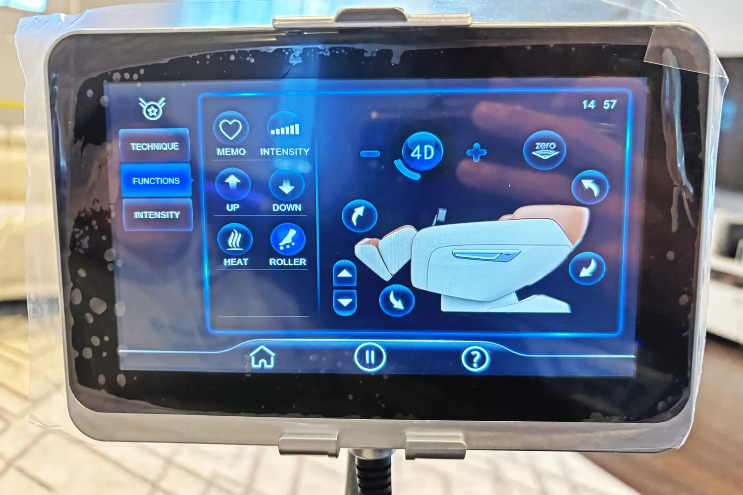 A close-up of the plastic covered display of the SCS Make Life Easy Lifesmart R775W 4D Massage Chair