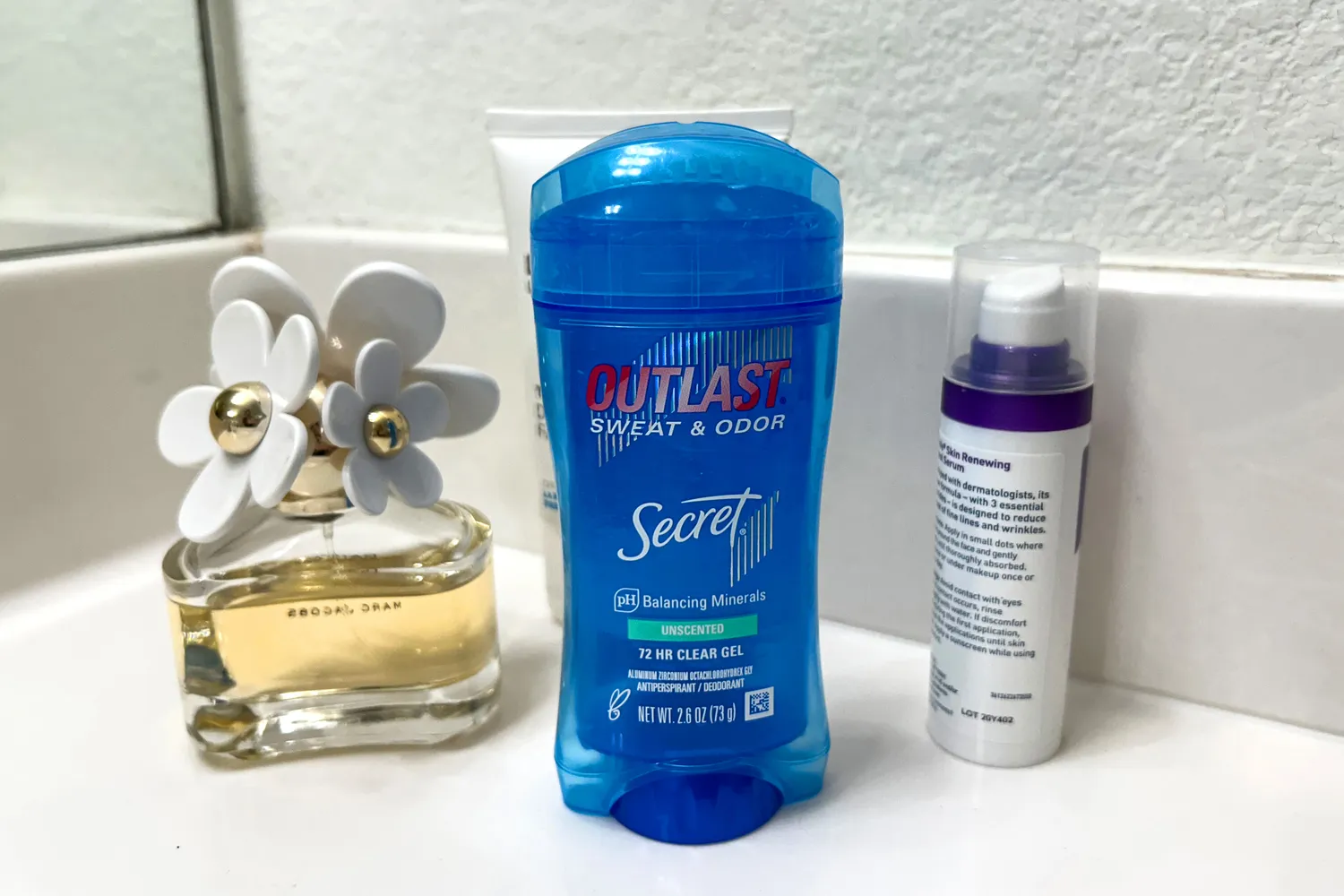 The Secret Outlast Antiperspirant Deodorant Gel on a bathroom countertop