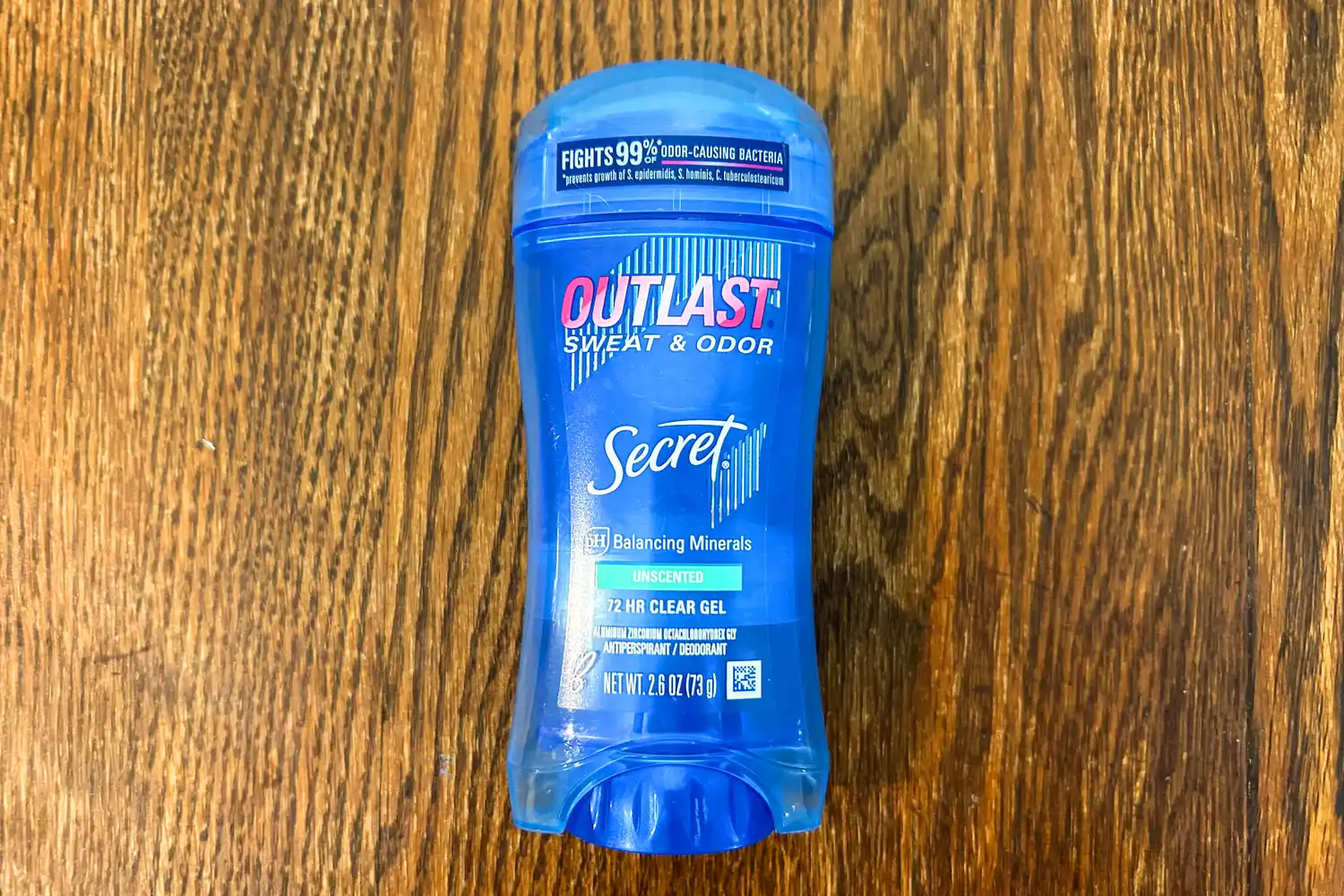The Secret Outlast Antiperspirant Deodorant Gel on a wooden table