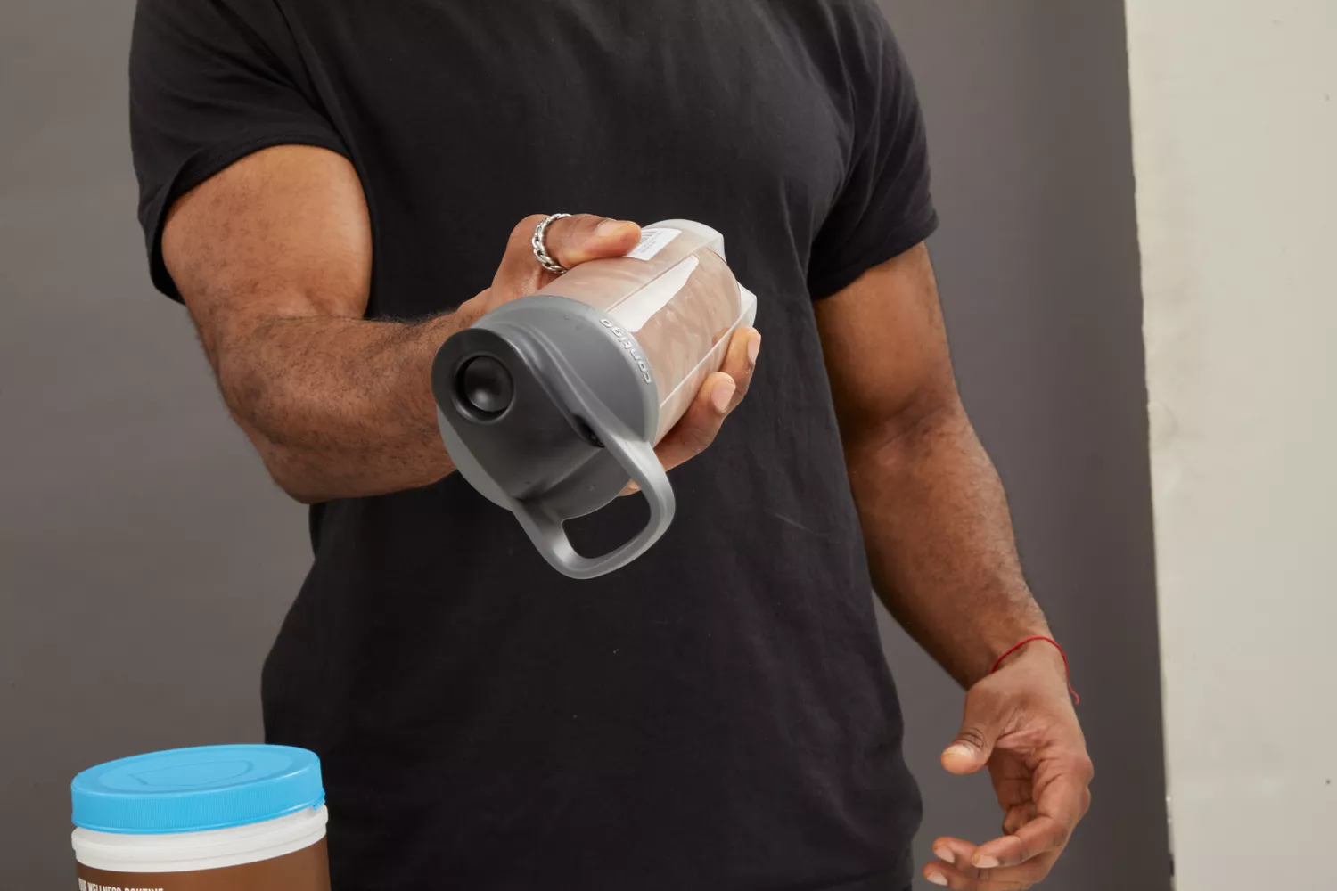 Person holding Contigo Shake and Go Fit Shaker Bottle upside down