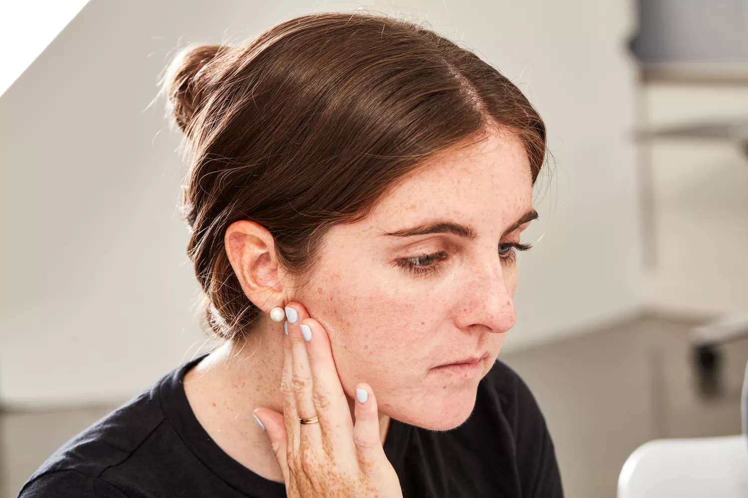 Person touching their face