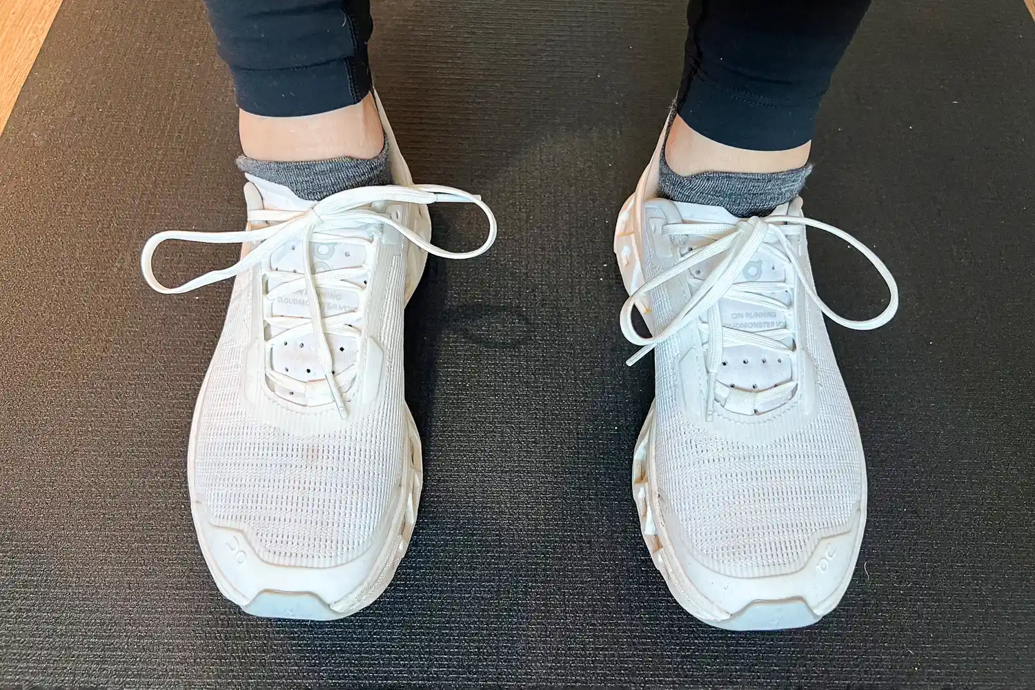 A person wears the Smartwool Run Low Ankle Socks while exercising