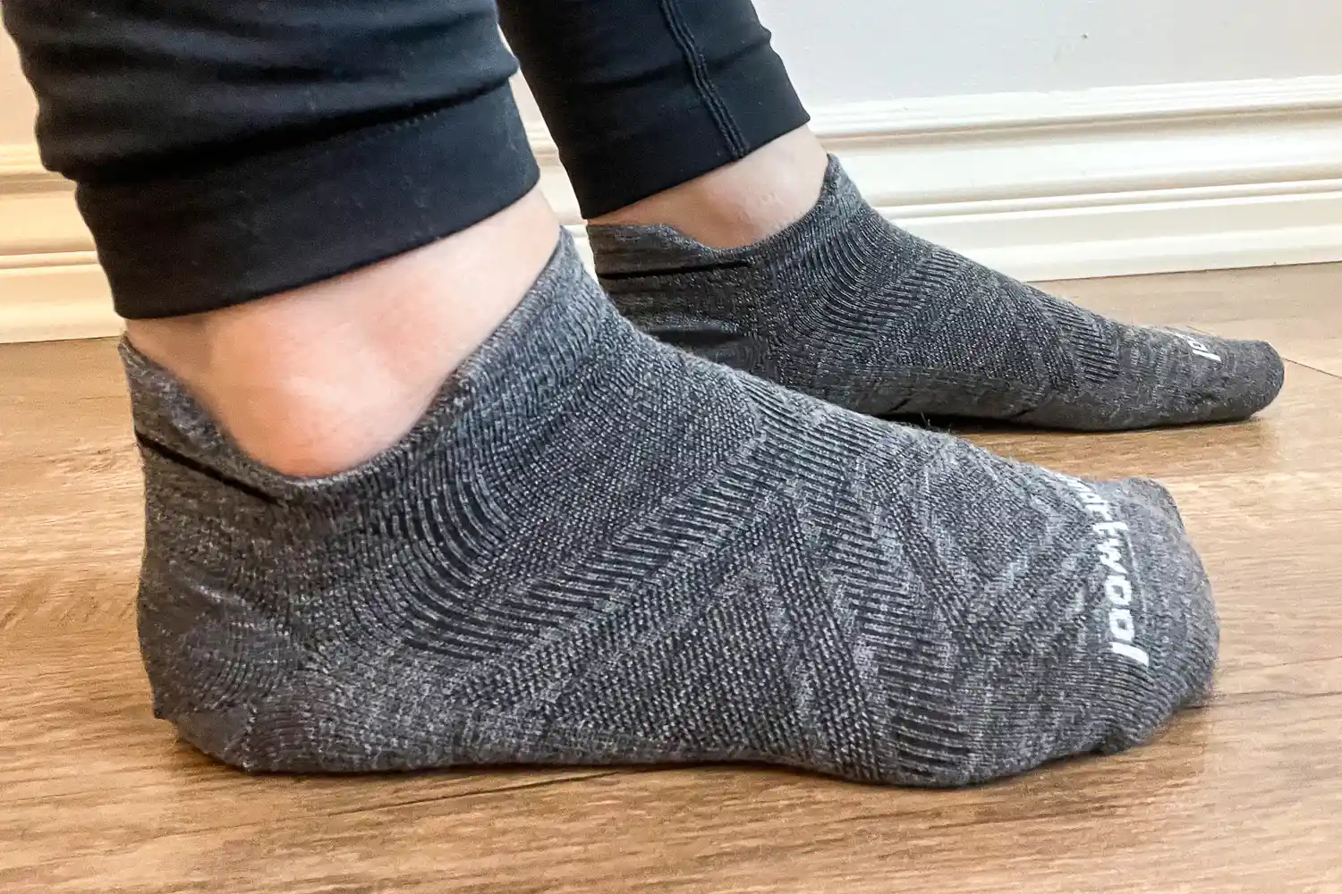 A side view of a person wearing the Smartwool Run Low Ankle Socks